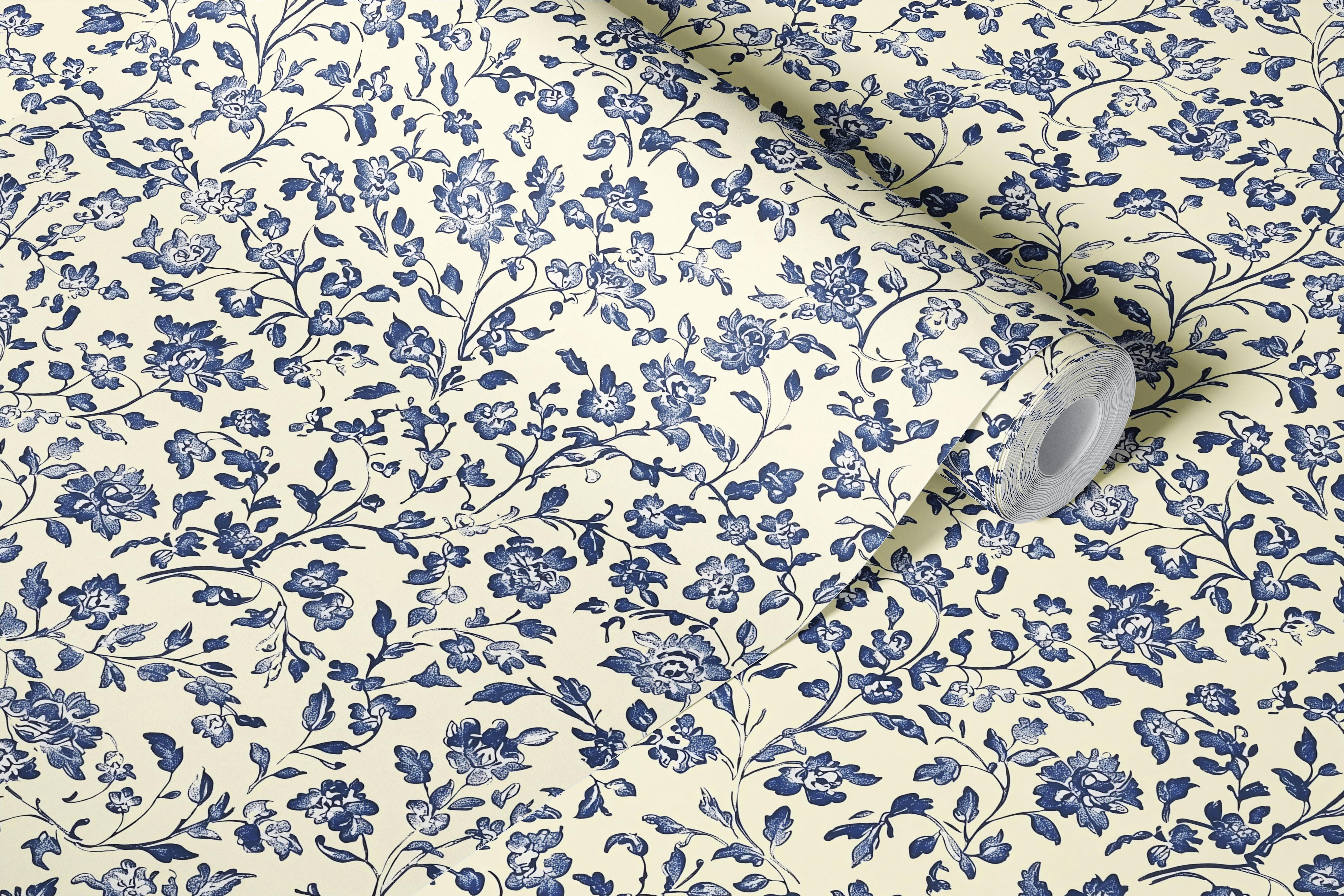 Blue floral pattern against a cream background wallpaper