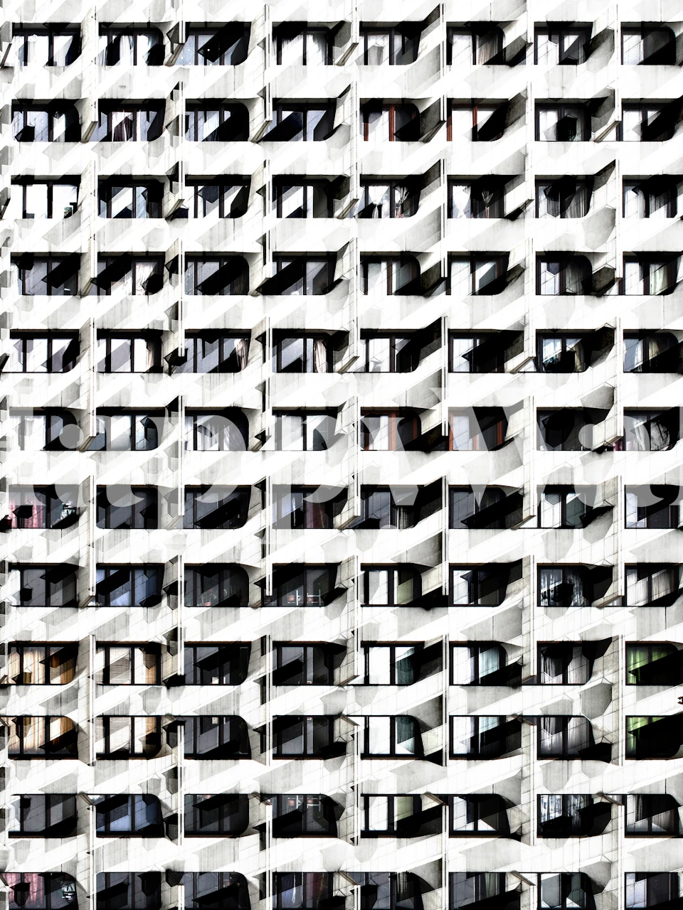 Fototapeta se vzorem opakujících se oken vytváří dynamický architektonický efekt