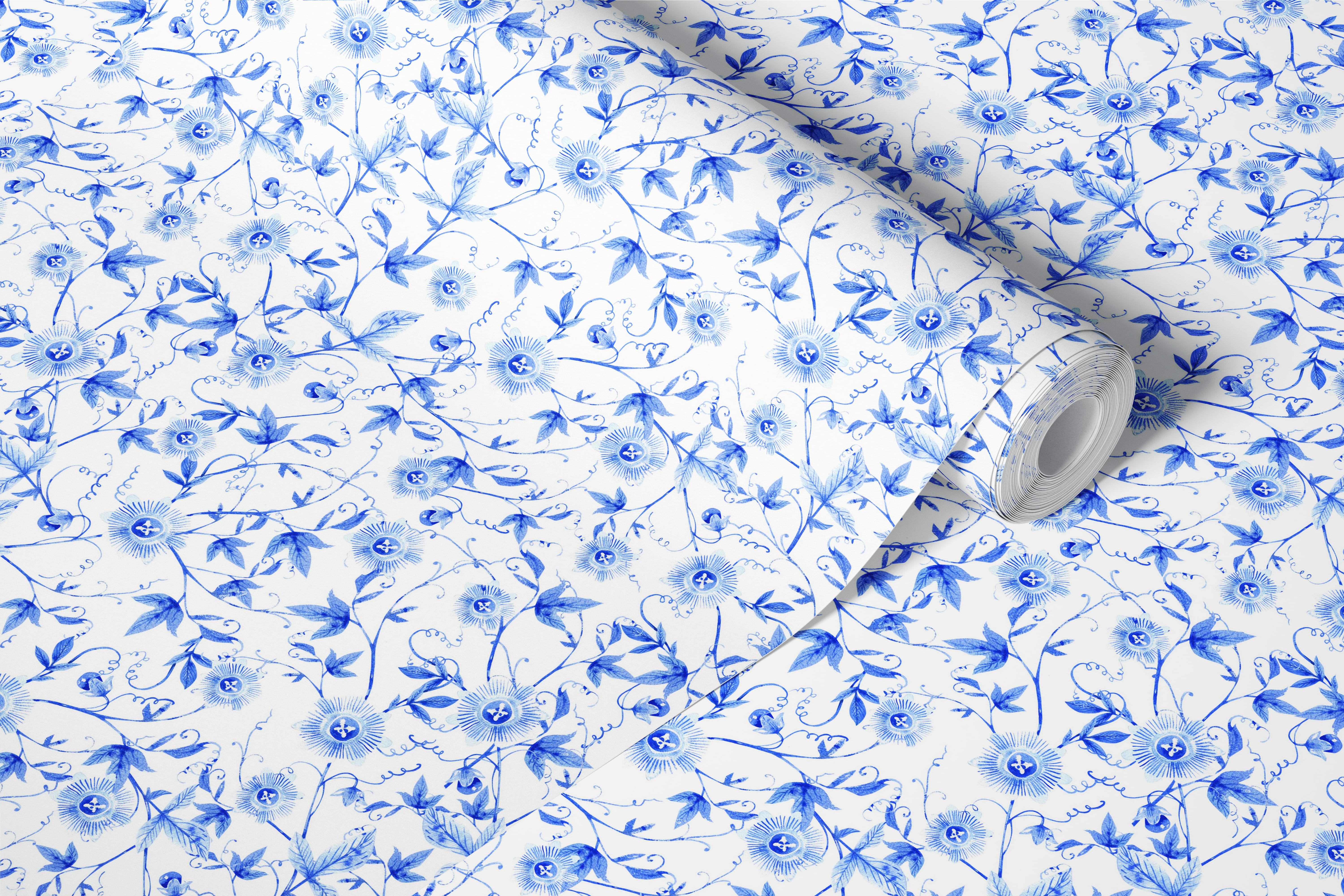 Blue floral pattern with vines and leaves on white wallpaper