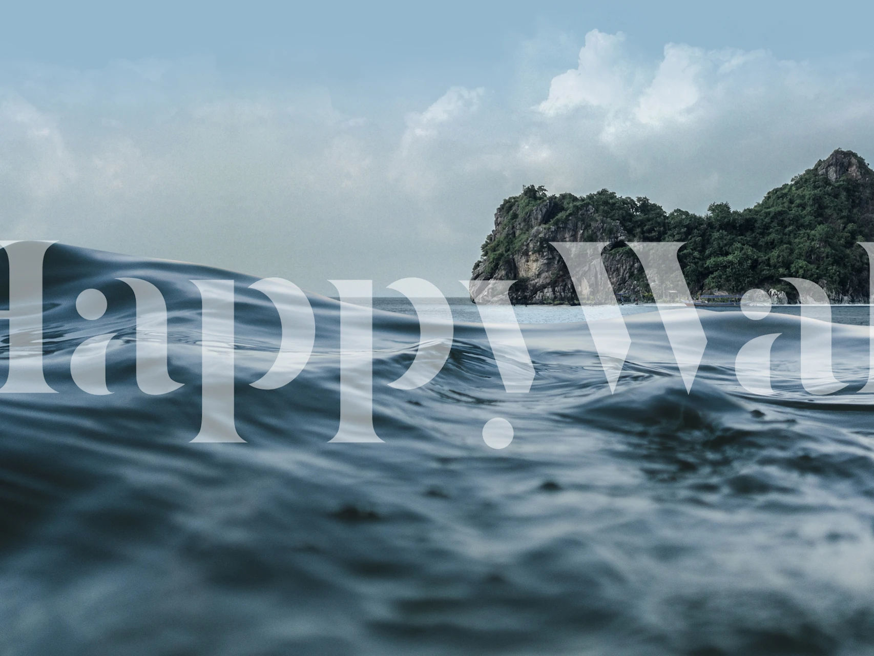 Ocean waves gently lapping against a rocky shore, blue and grey wallpaper