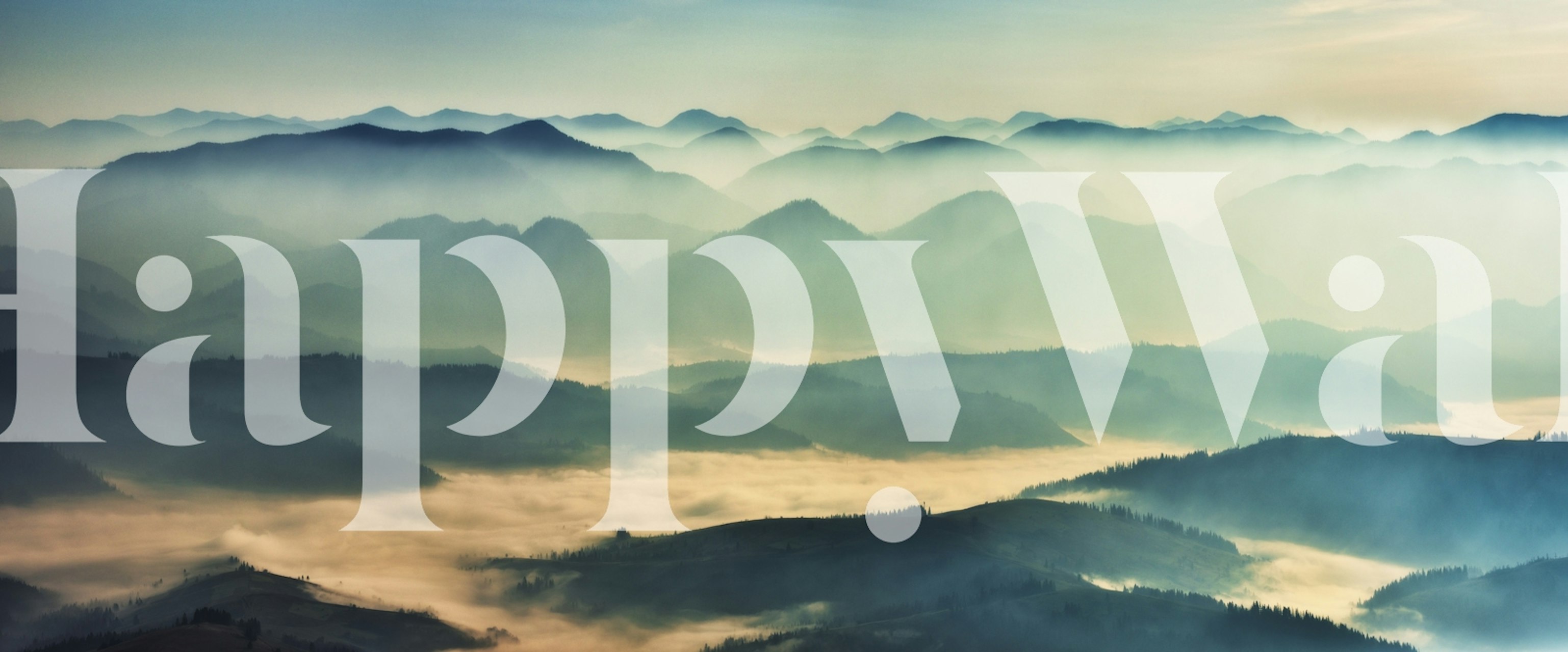 Morning mist over mountains wallpaper in a room