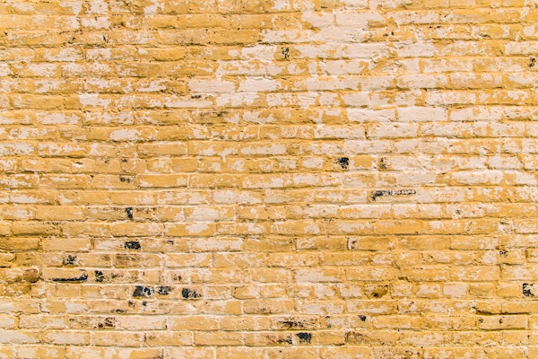 Weathered Yellow Brick Wall