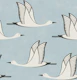 Flying birds - light faded blue background