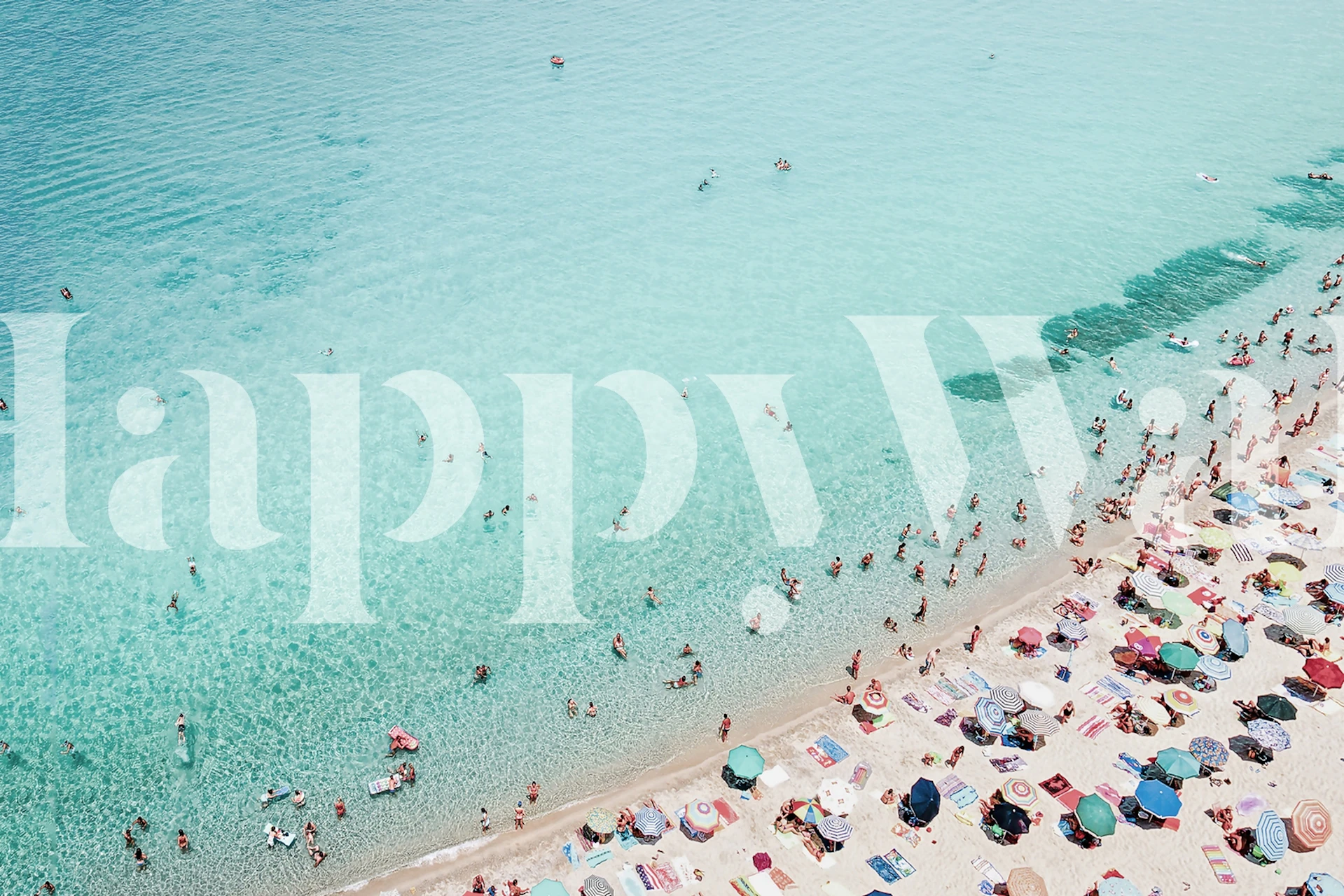 Tropical beach scene with turquoise water and colorful umbrellas wallpaper