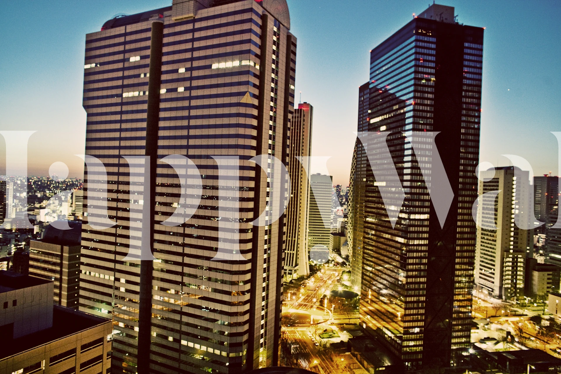 Tokyo city skyline at dusk with tall buildings and lights wallpaper