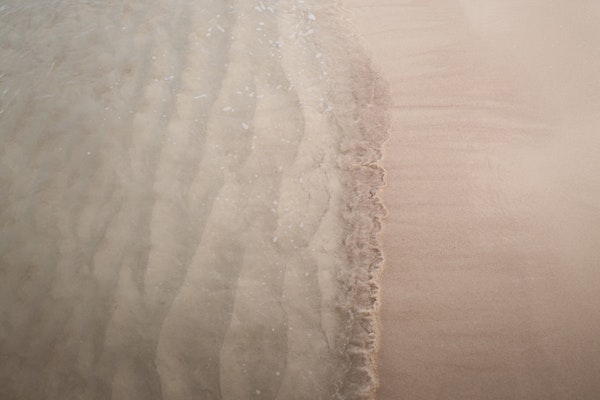 Serene Sea Meets Sandy Beach 1