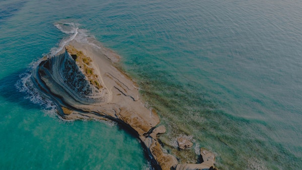 Coastal Cliff Over Clear Water