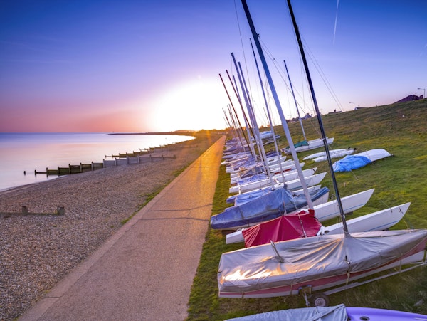 Sunset Sailboats on Coastal Path
