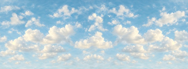 Soft Blue Sky With Puffy Clouds