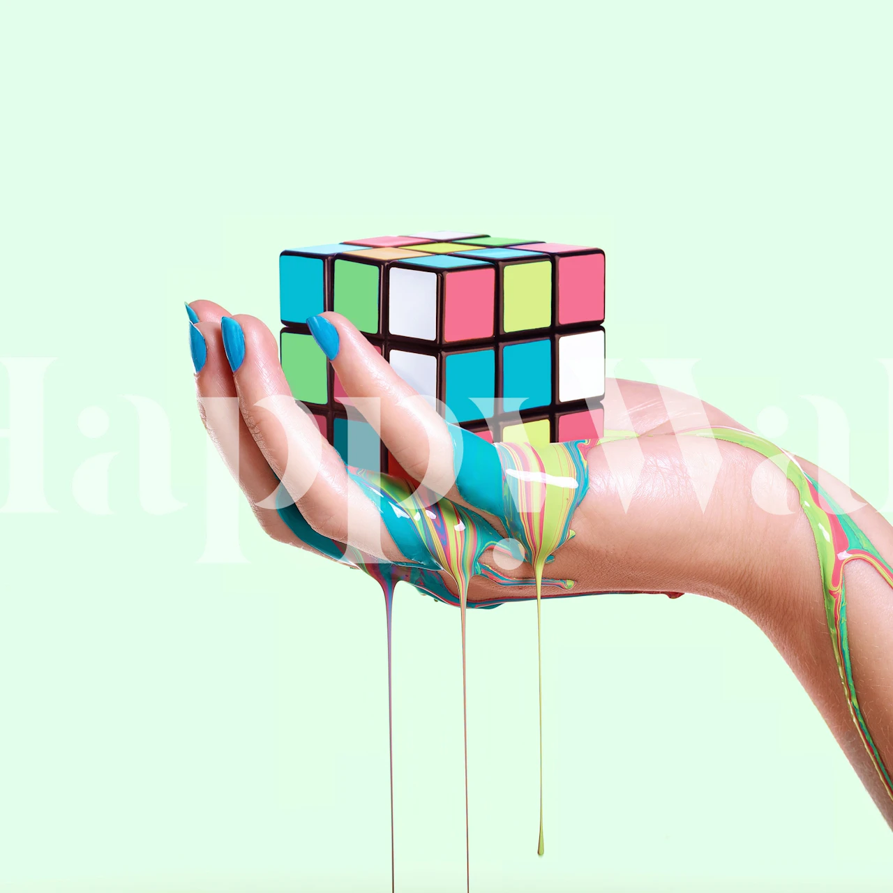 Papier peint mural Rubik's Cube fondant coloré dans la main