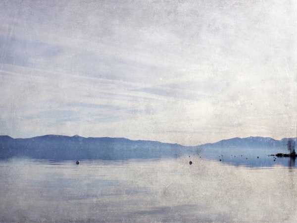 Pale blue mountain lake view