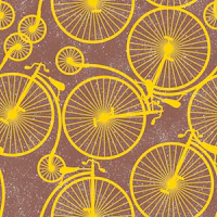 Mustard yellow bike wheels on taupe tapeet