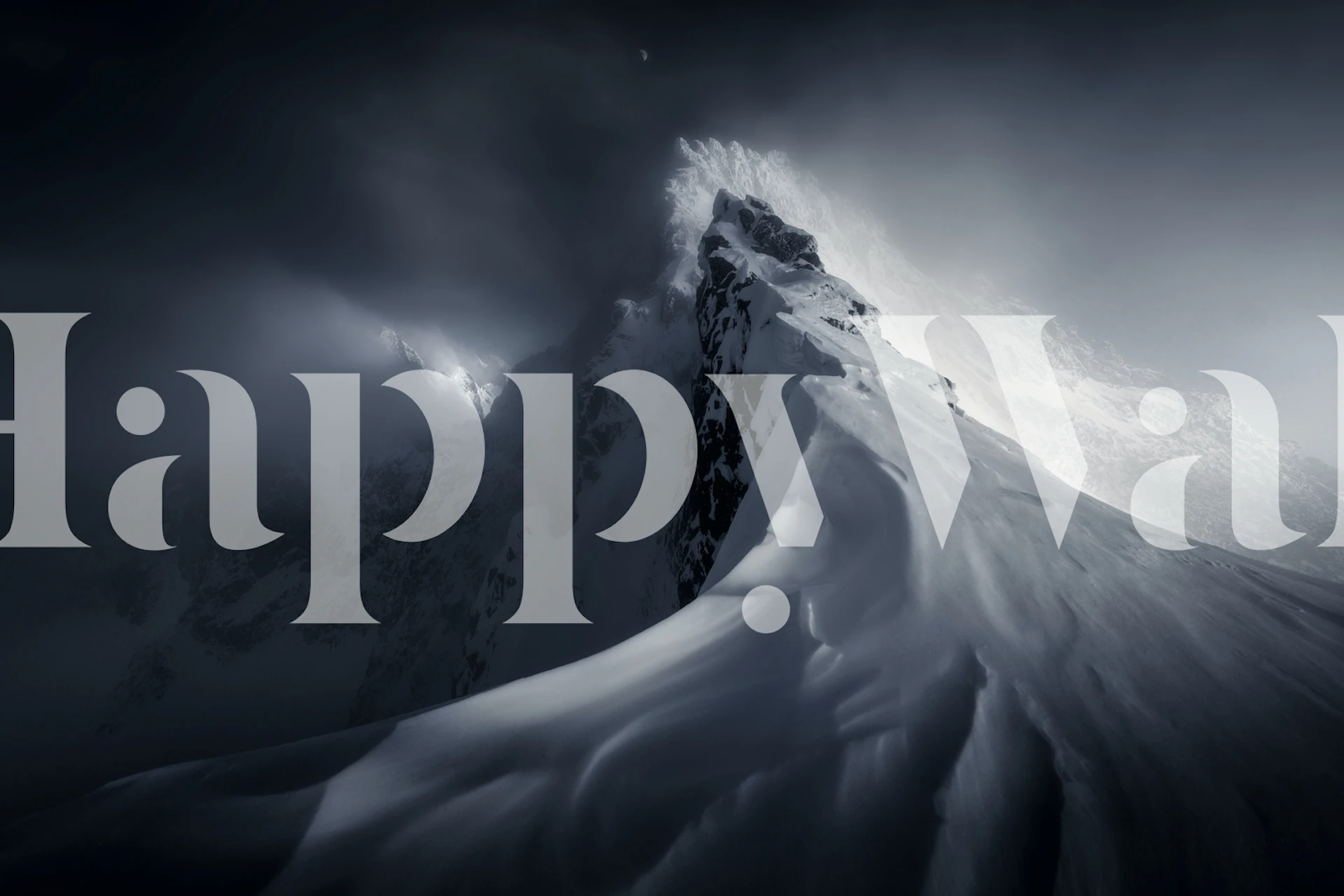 Majestic snowy mountain peak with dark clouds wallpaper