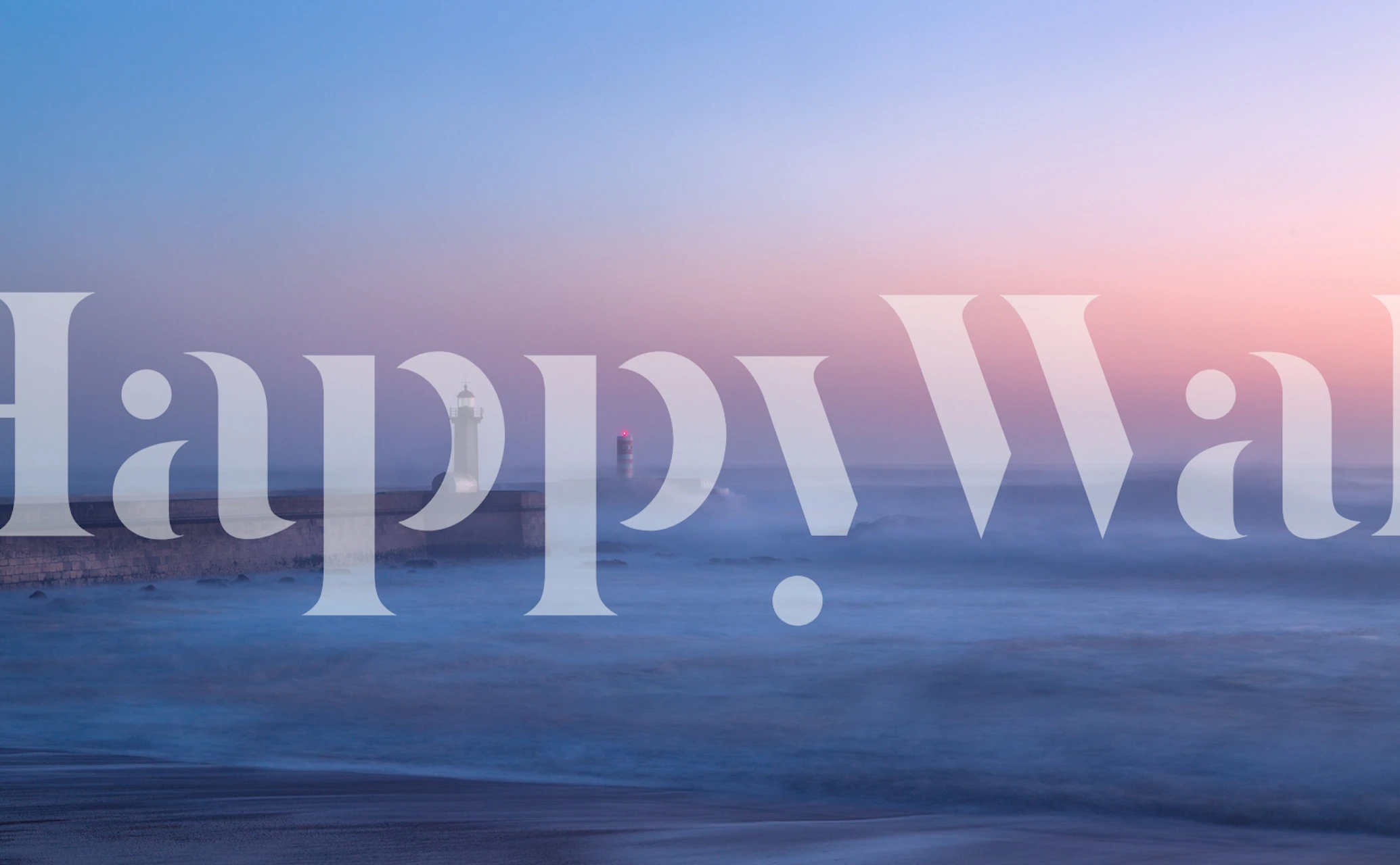 Lighthouse on a rocky pier at sunset with soft blue and pink hues wallpaper