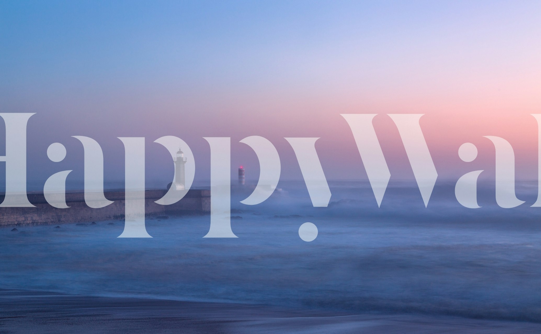 Lighthouse on a rocky pier at sunset with soft blue and pink hues wallpaper