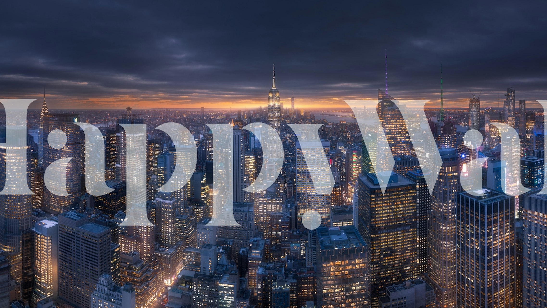 City skyline at night with glowing lights and dark sky wallpaper