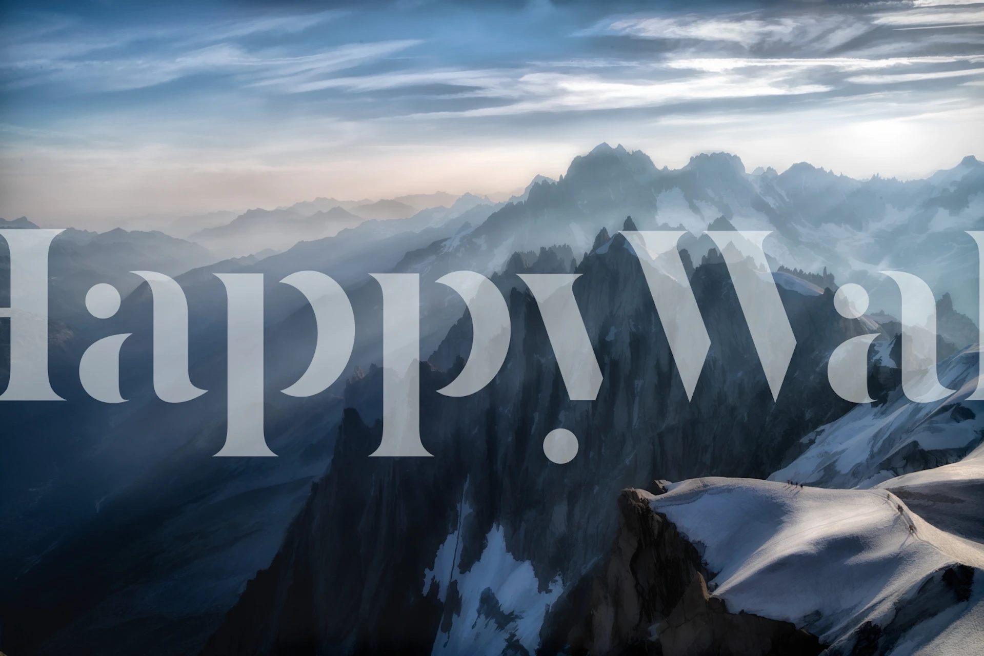 Mountain landscape with misty peaks and soft sunlight wallpaper