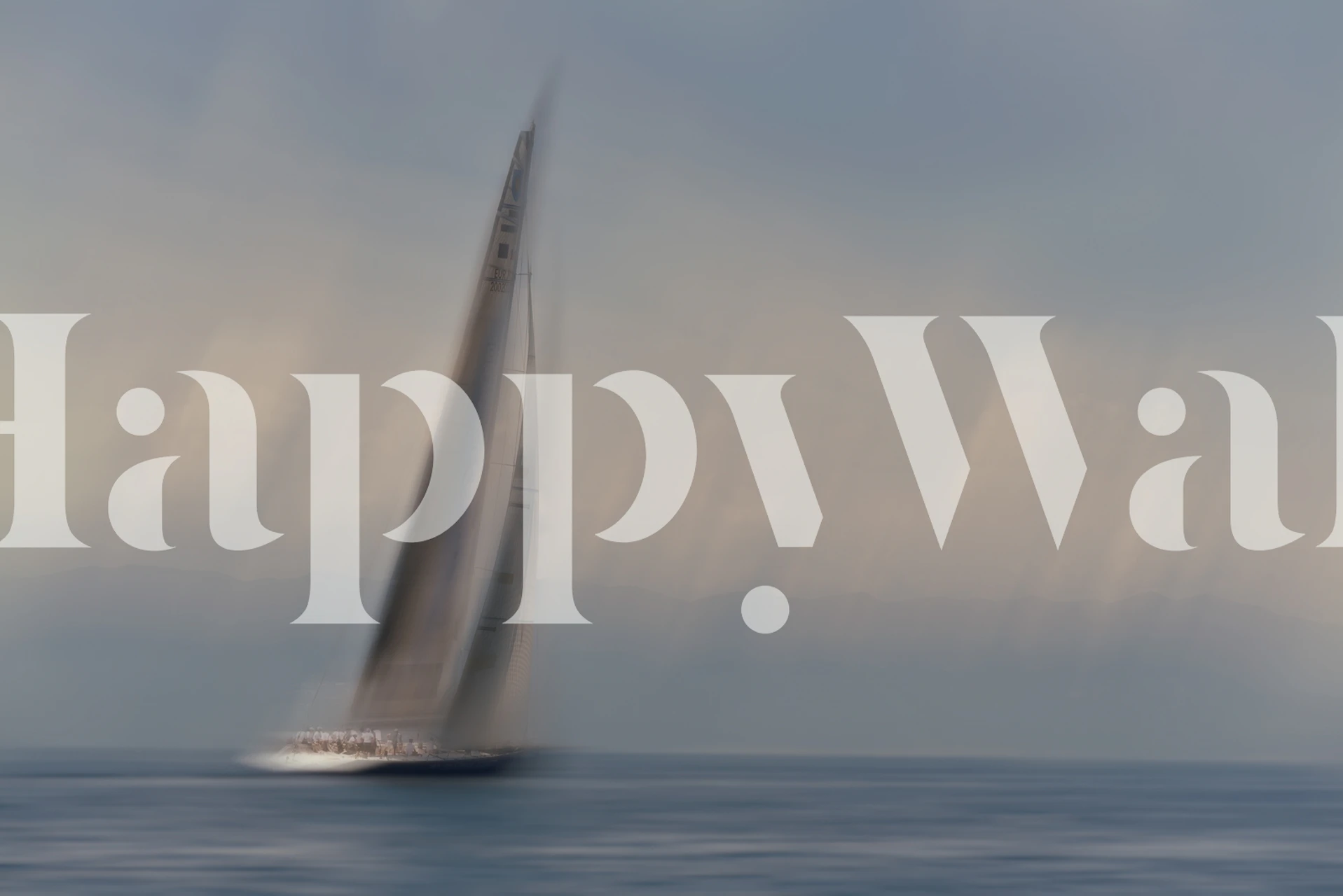 Blurred sailing yacht on calm ocean water in soft colors wallpaper