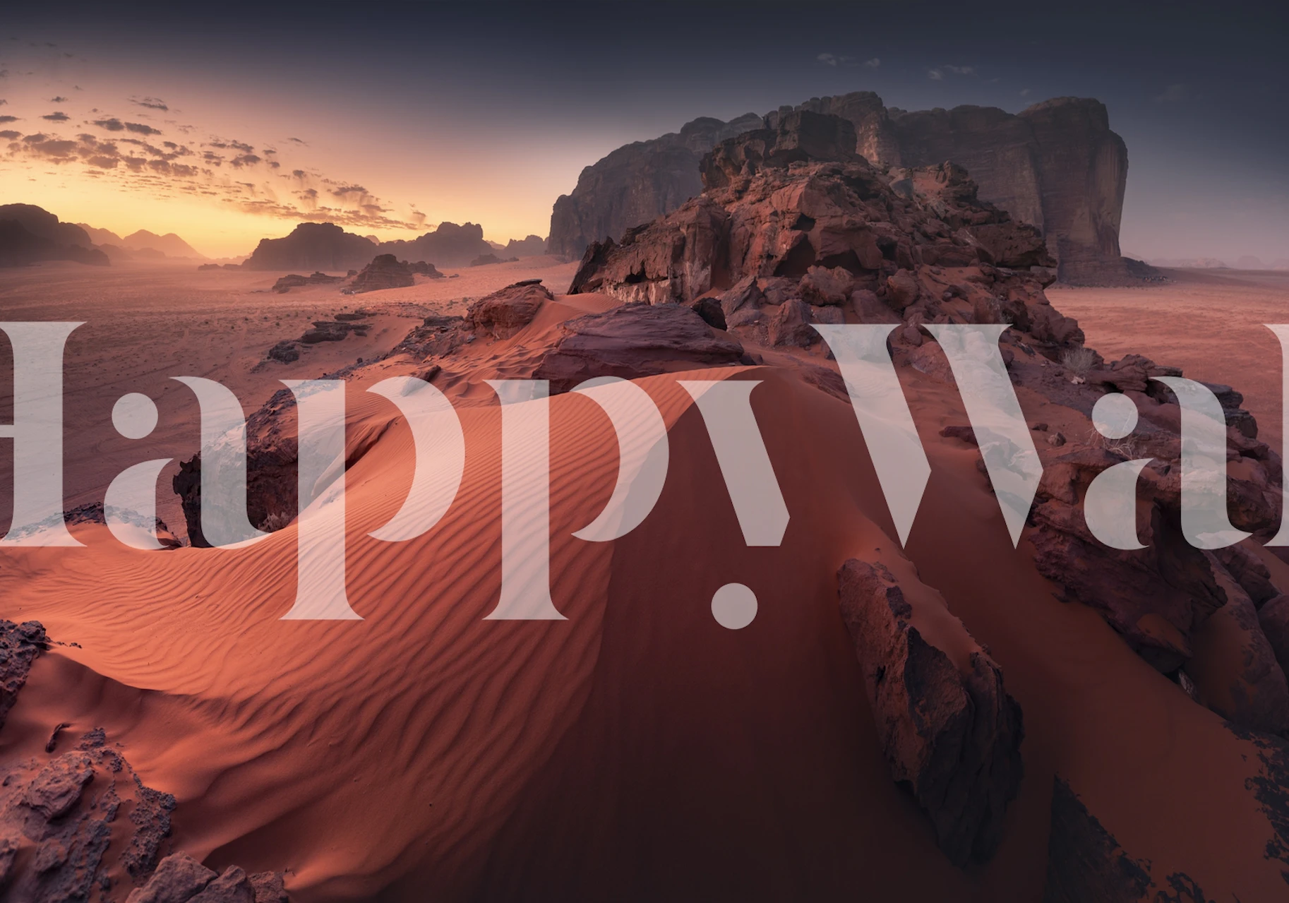 Red desert sand dunes and rocky landscape wallpaper