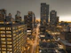 Charcoal downtown buildings sunset horizon