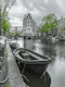 Bright green trees and grey canal