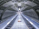 Cool gray underground escalator view