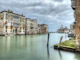 Mustard yellow facade beside seafoam canal