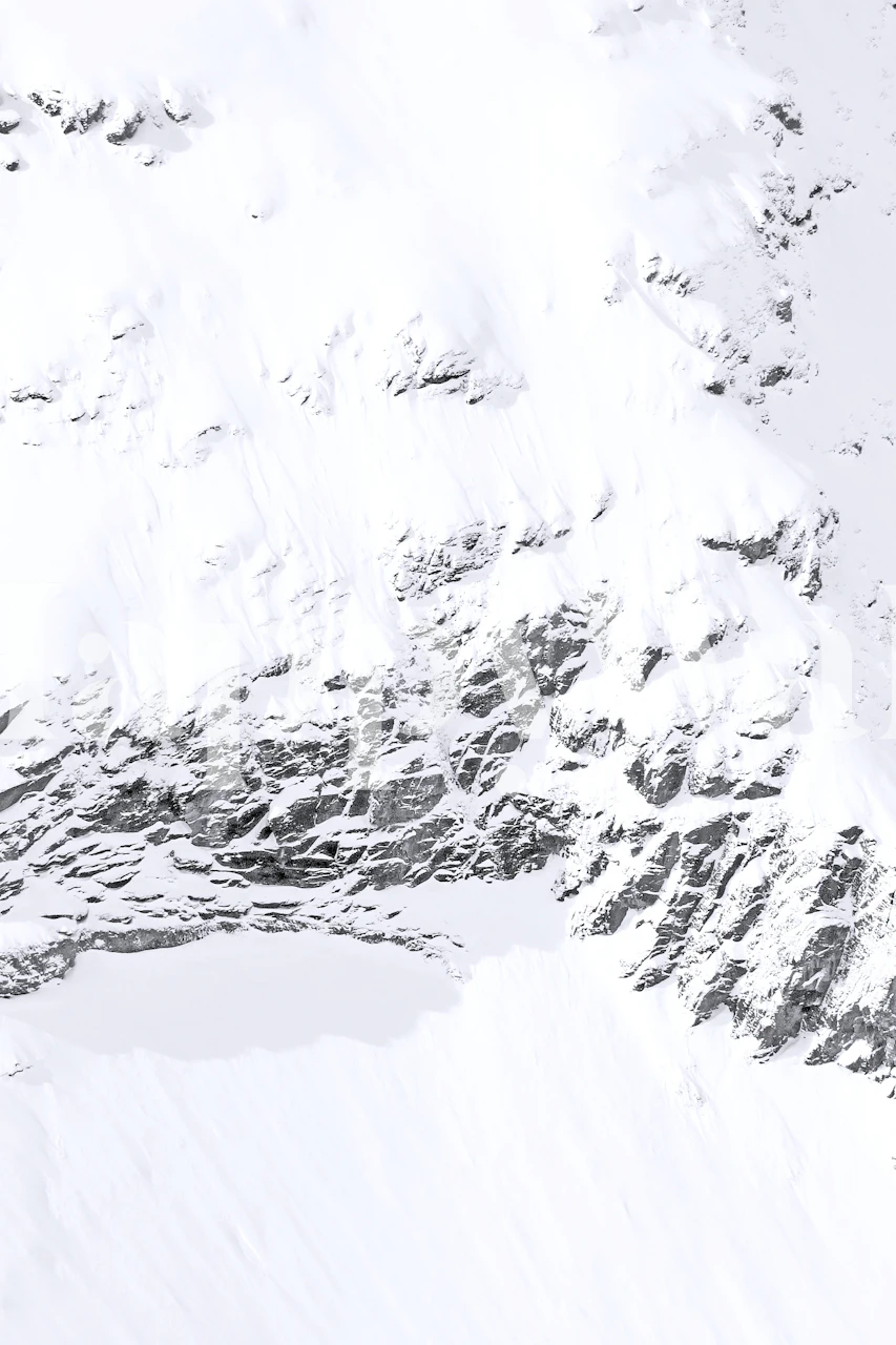 Snowy mountain landscape in white and gray tones wallpaper