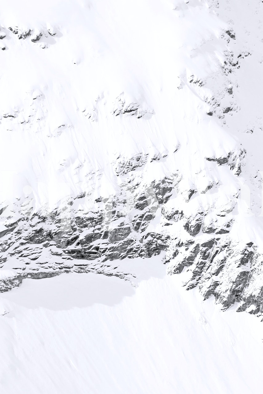 Snowy mountain landscape in white and gray tones wallpaper