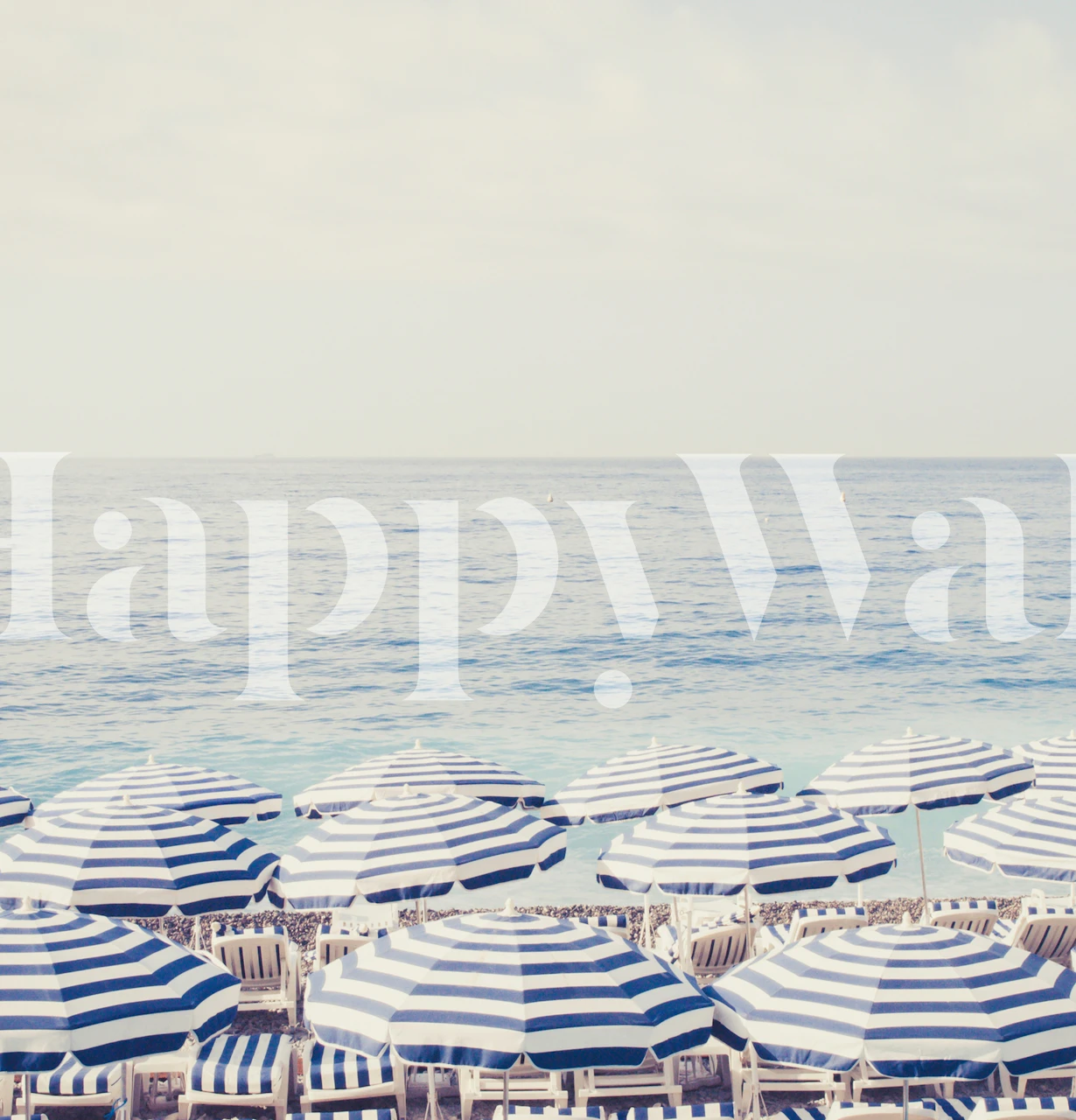 Blue and white striped beach umbrellas against a sea horizon wallpaper