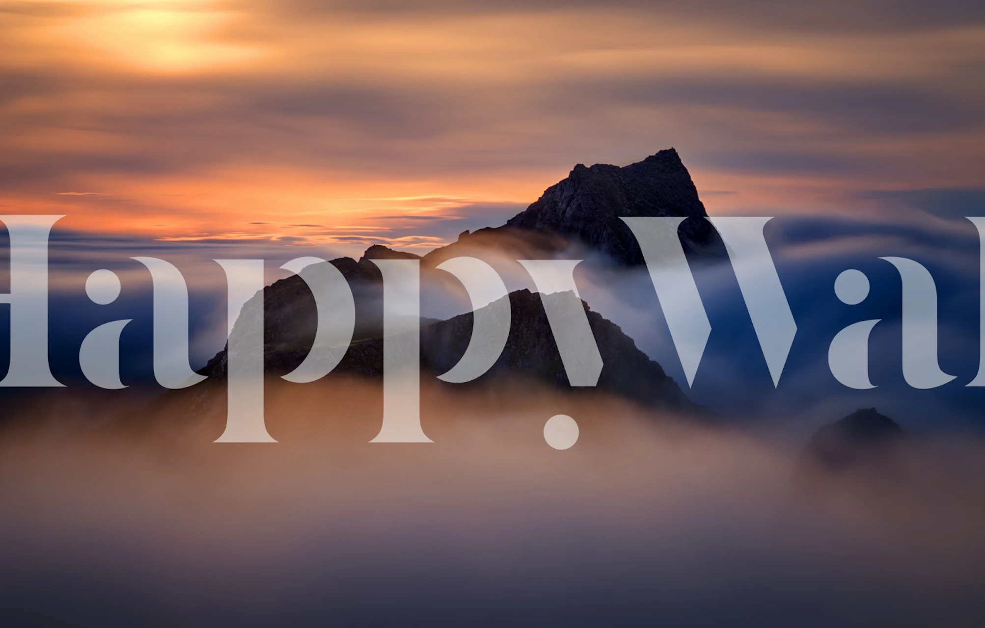 Majestic mountain peak with misty clouds wall mural