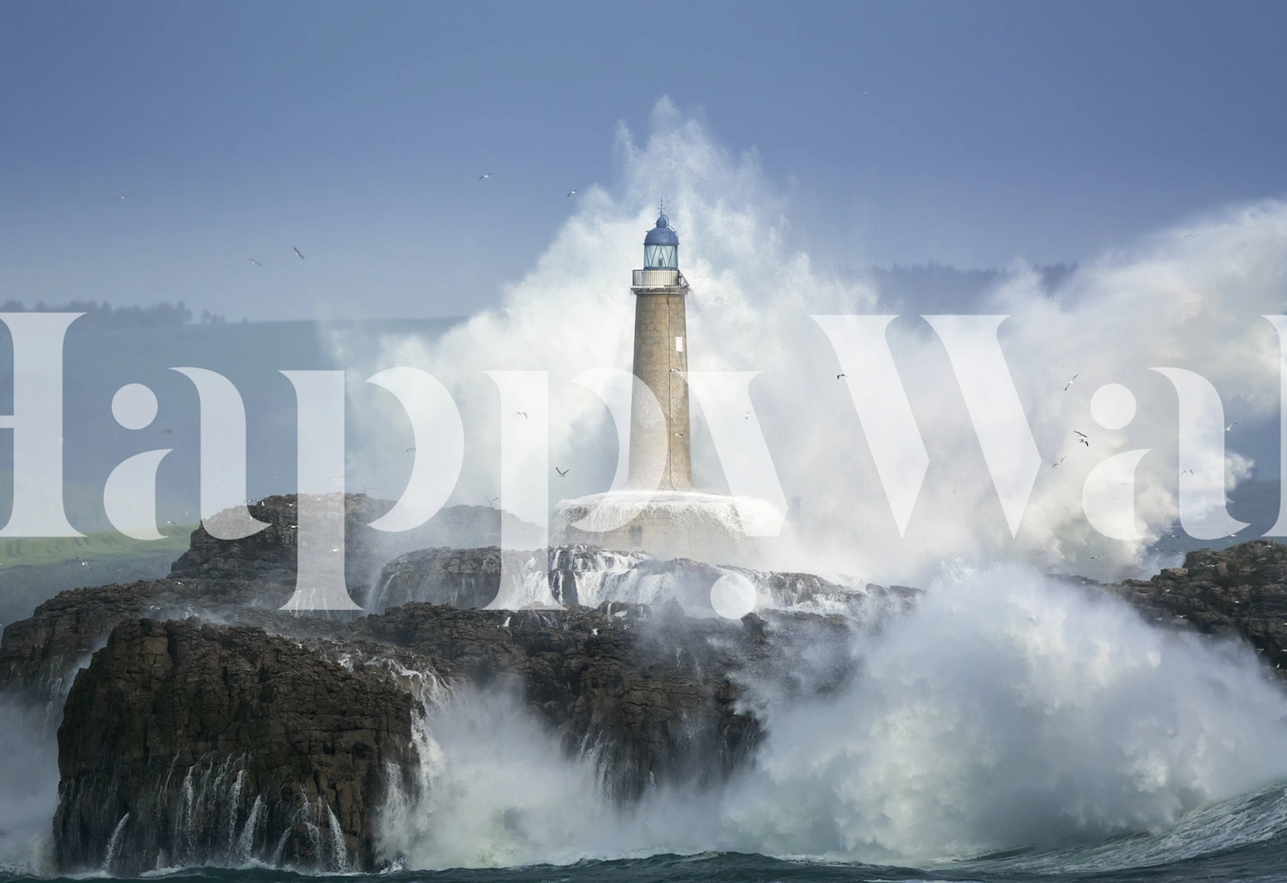 Lighthouse on rocky shore with crashing waves, blue and white wallpaper