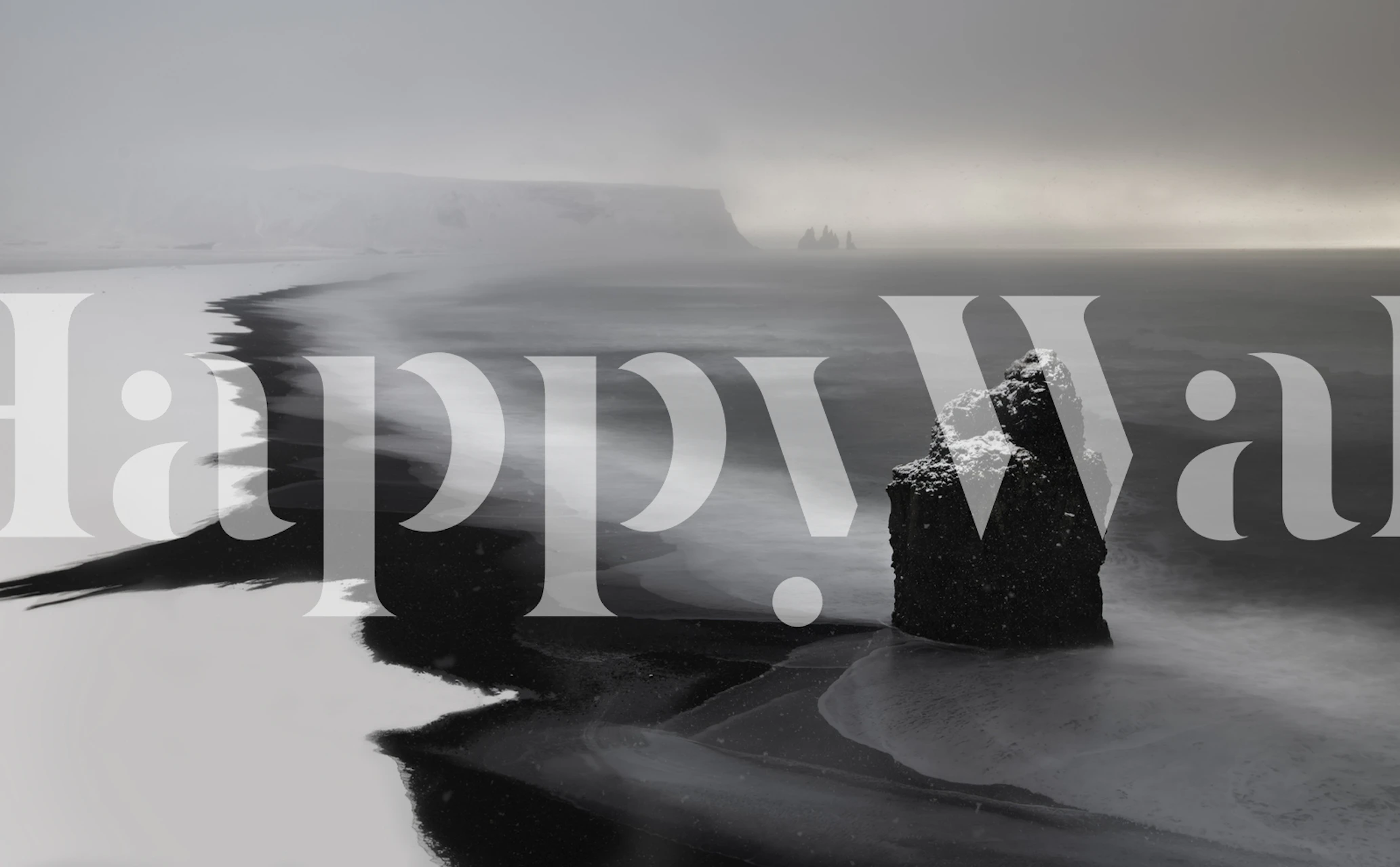 Black and white coastal landscape wallpaper with rocky shore