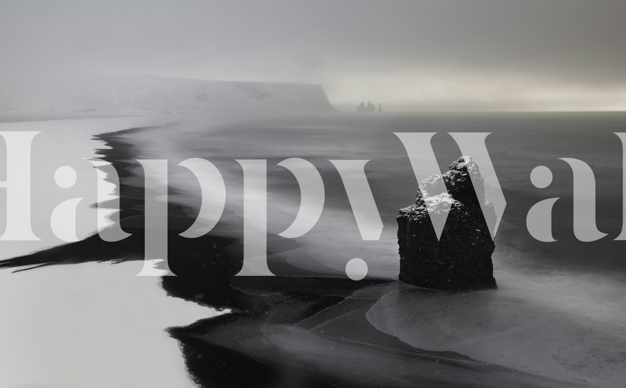 Black and white coastal landscape wallpaper with rocky shore