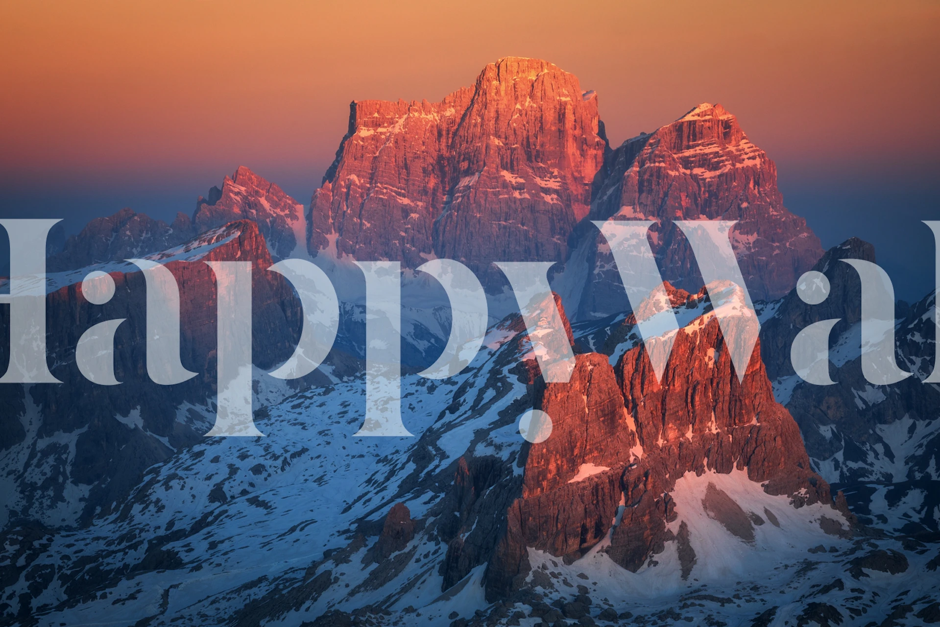 Mountain peaks illuminated by a vibrant sunset, snowy landscape, decorative wallpaper