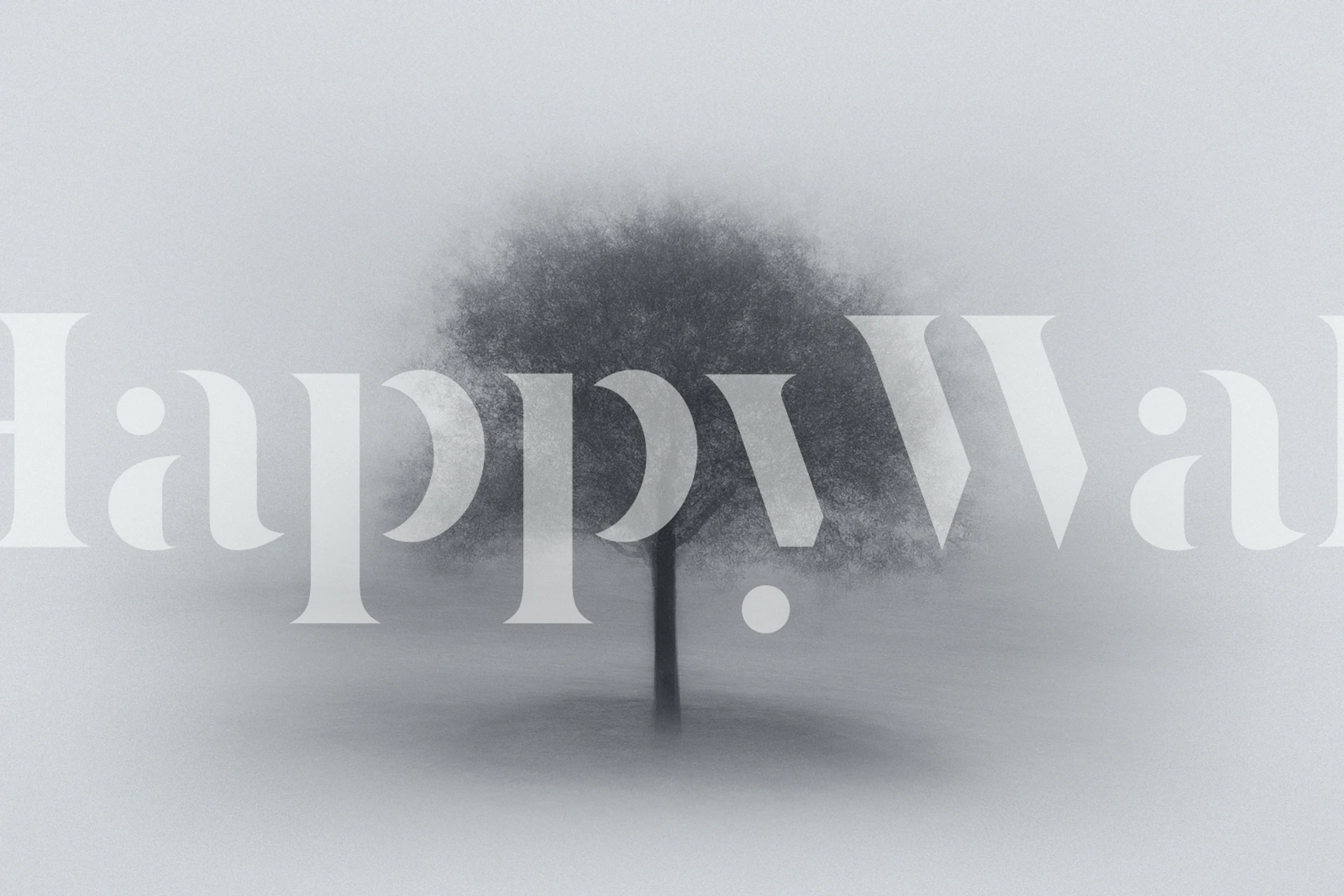 Monochrome wall mural of a single tree enveloped in fog