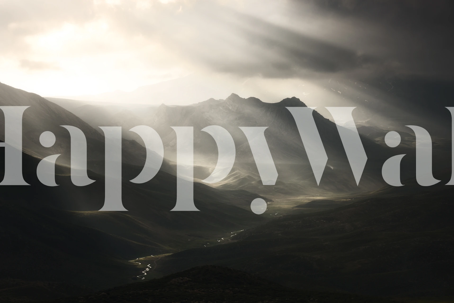 Mountain landscape with sun rays and dark clouds wallpaper