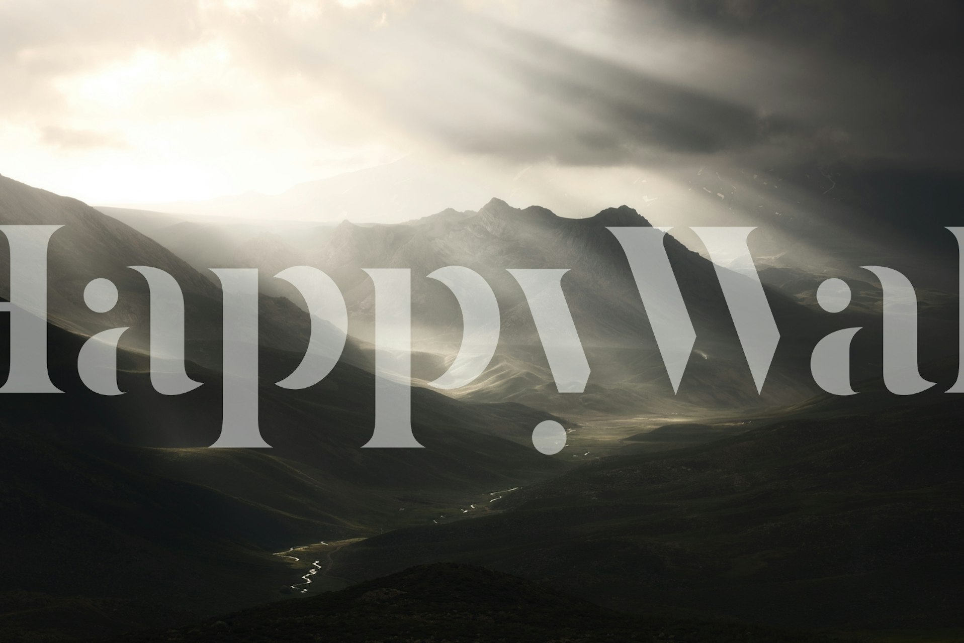 Mountain landscape with sun rays and dark clouds wallpaper