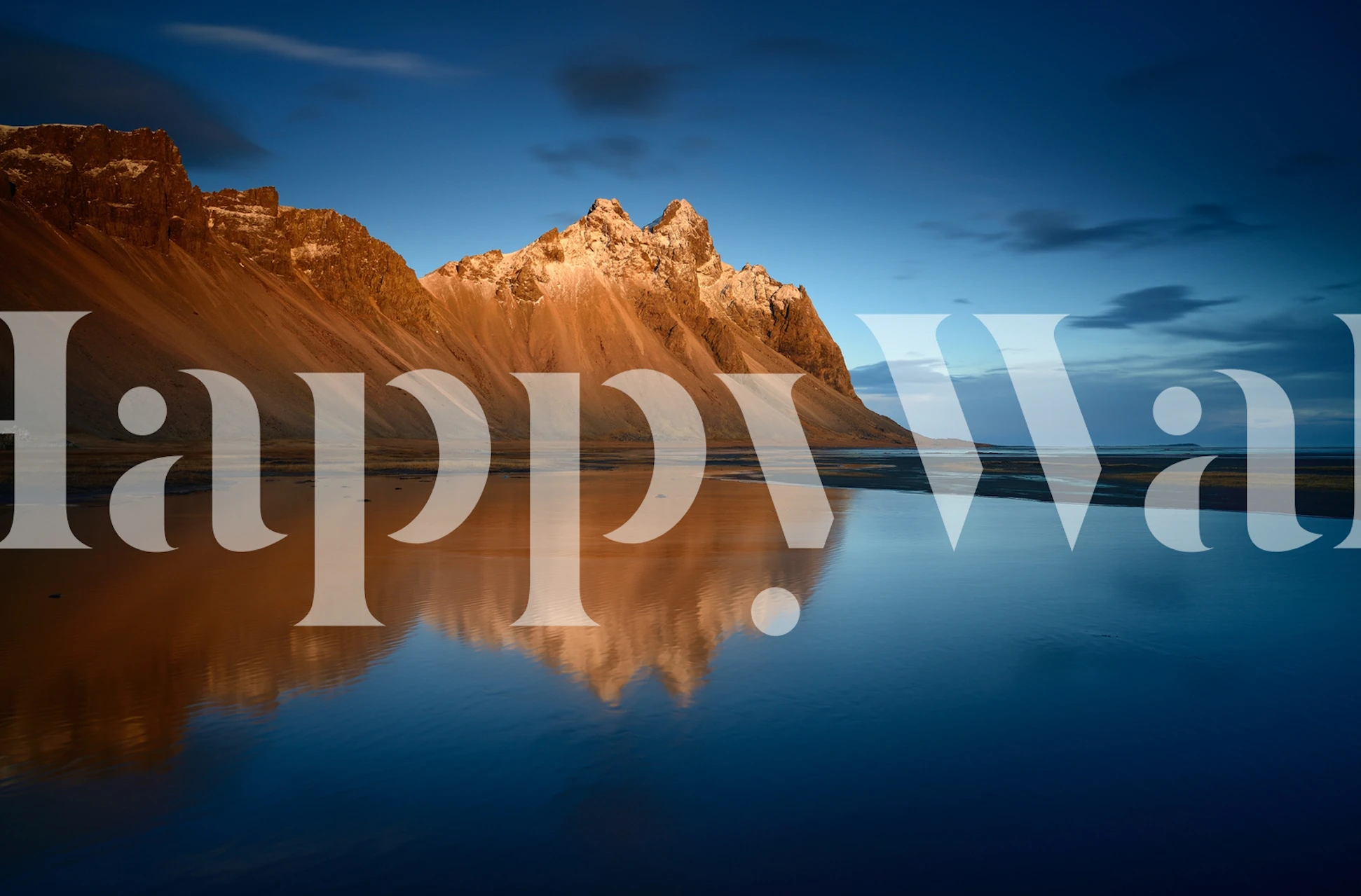 Mountain landscape reflecting in water at sunset wallpaper