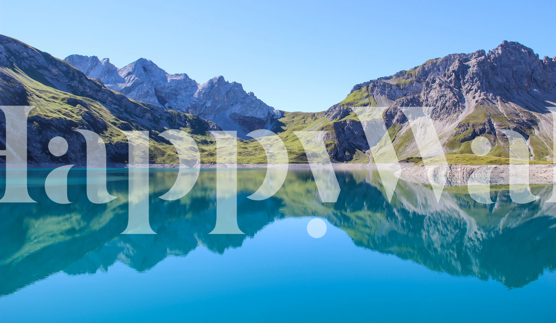 Mountain reflection in calm blue lake wallpaper