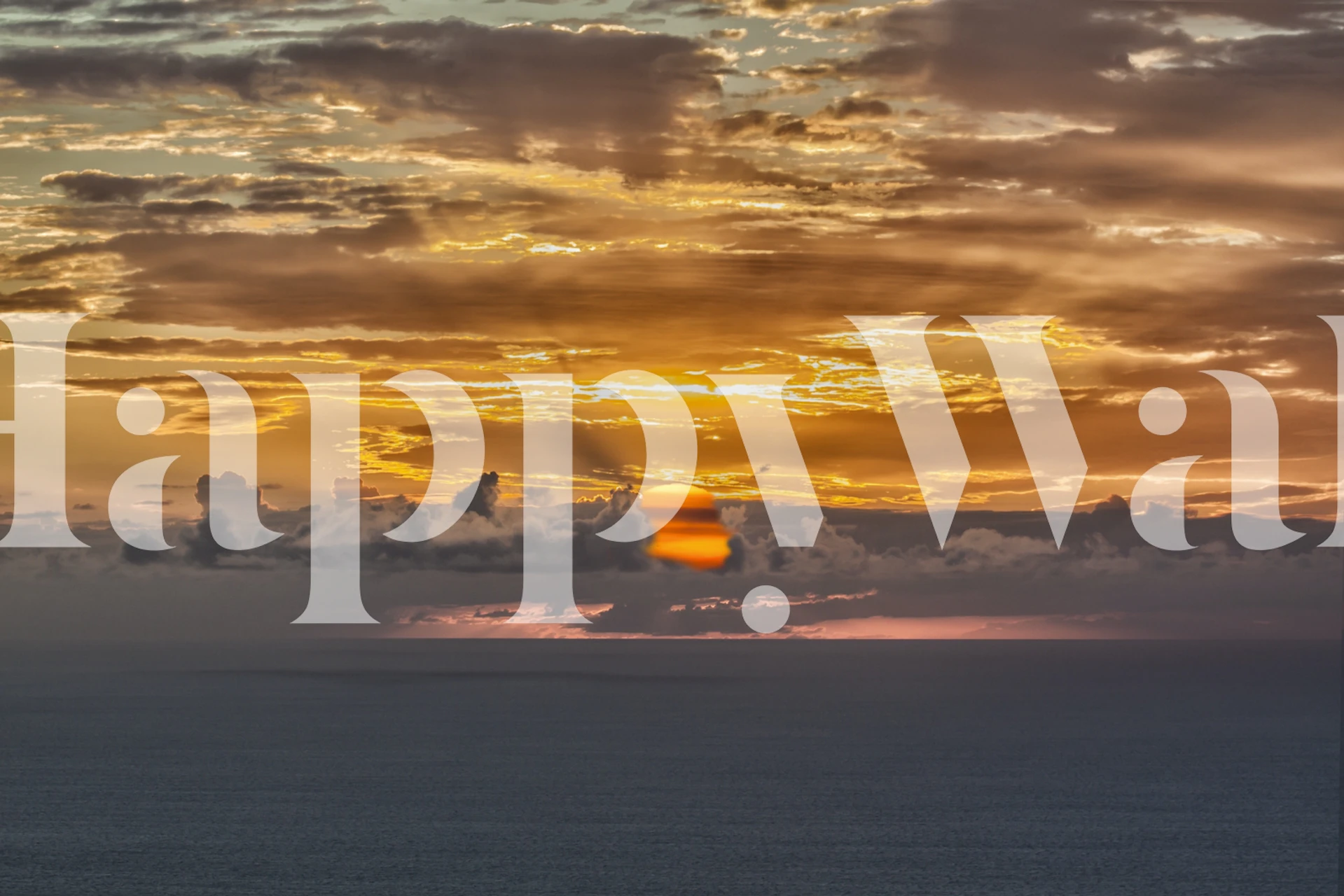 Ocean sunrise with orange and blue tones wallpaper