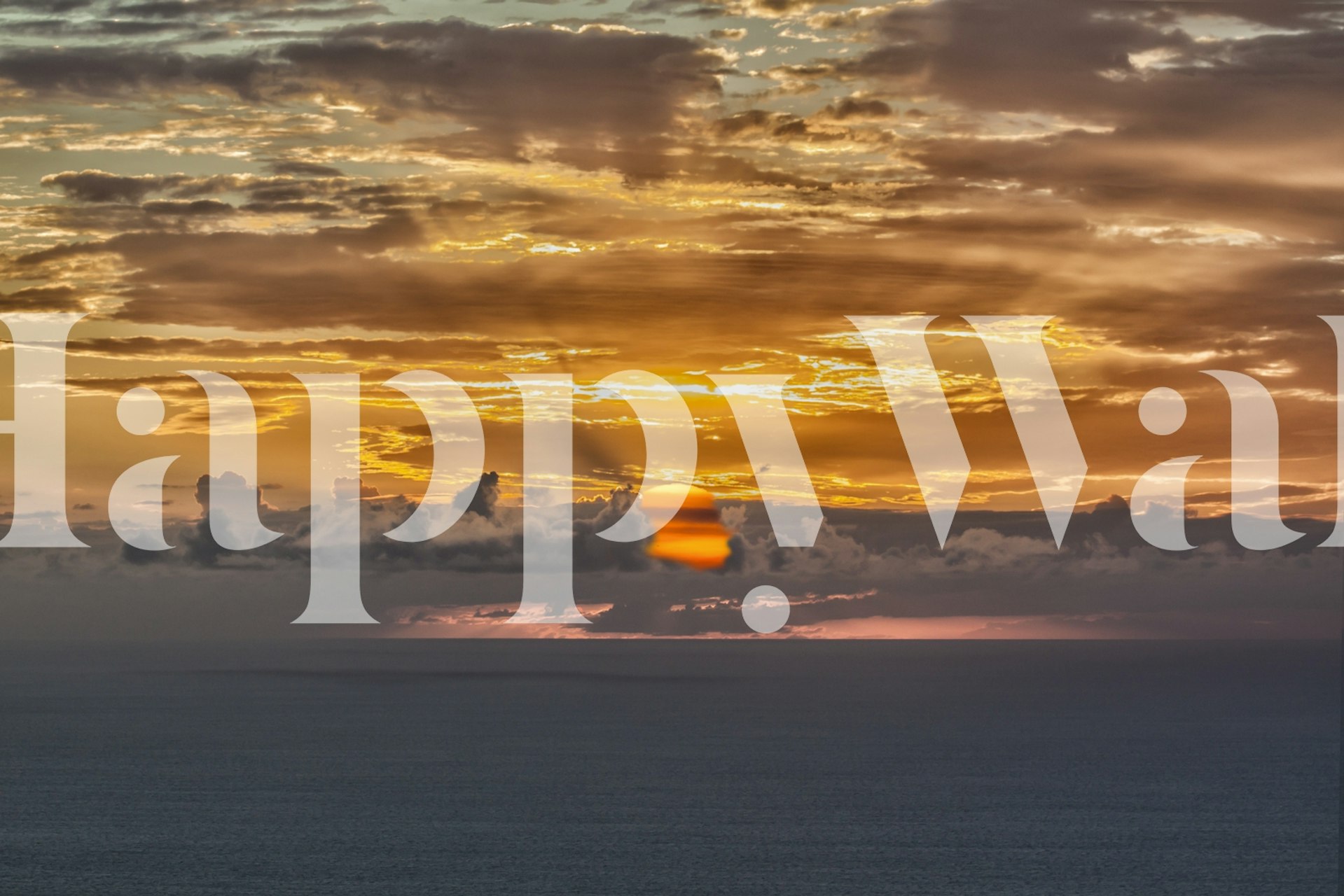 Ocean sunrise with orange and blue tones wallpaper