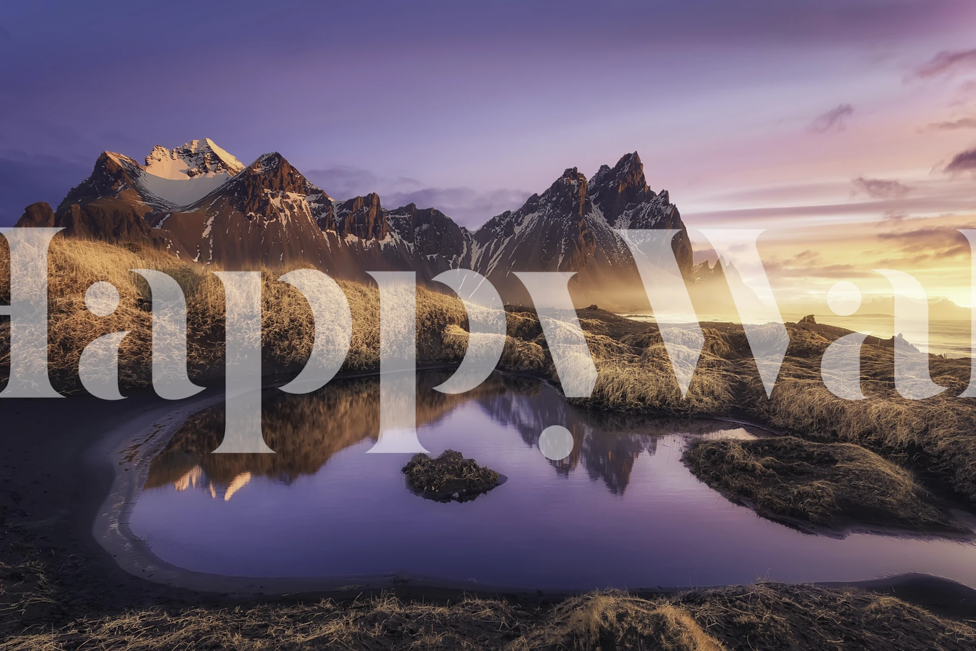 Mountain landscape wallpaper featuring purple hues and golden reflections