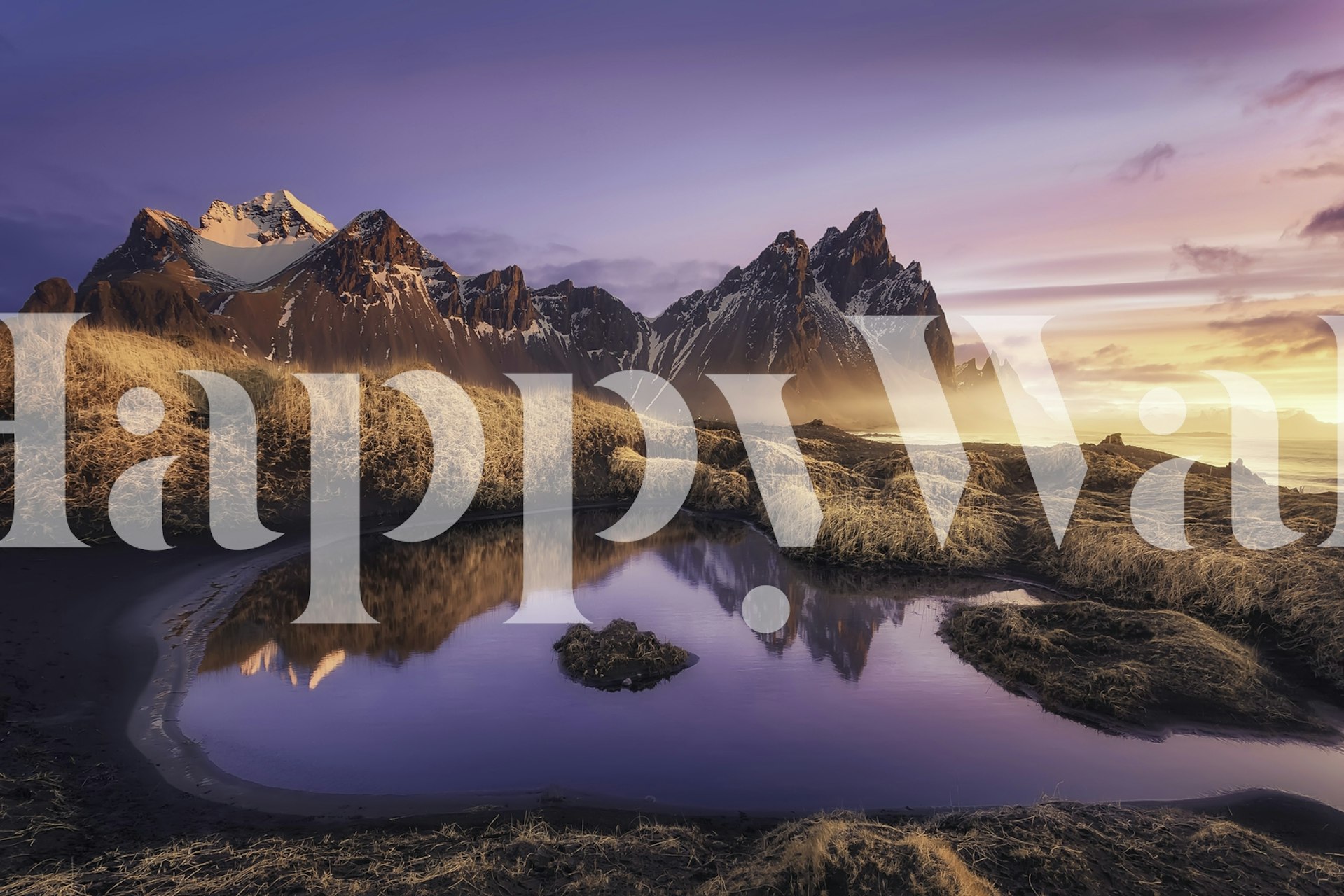 Mountain landscape wallpaper featuring purple hues and golden reflections