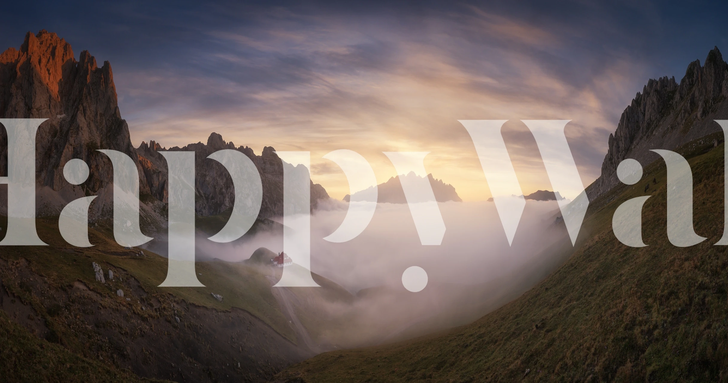 Panoramic mountain view wall mural with dawn light and mist