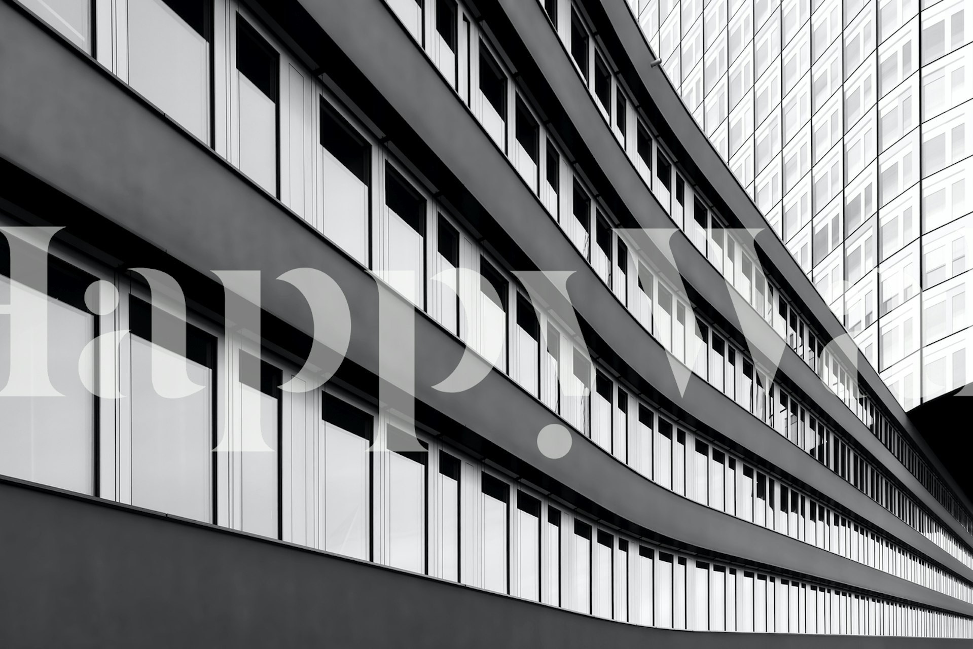 Black and white wall mural featuring modern architectural lines of a workplace building
