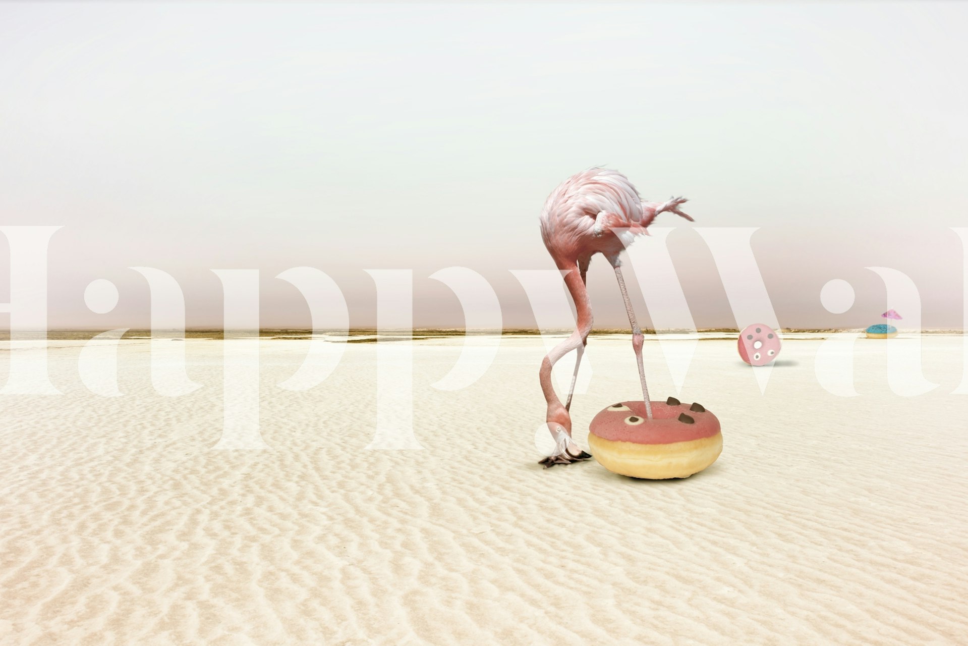 Flamingo standing on a donut with a sandy background wallpaper