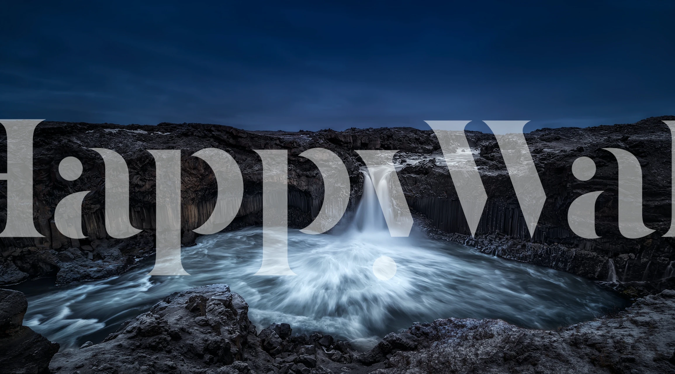 Icelandic waterfall landscape with gray tones wallpaper