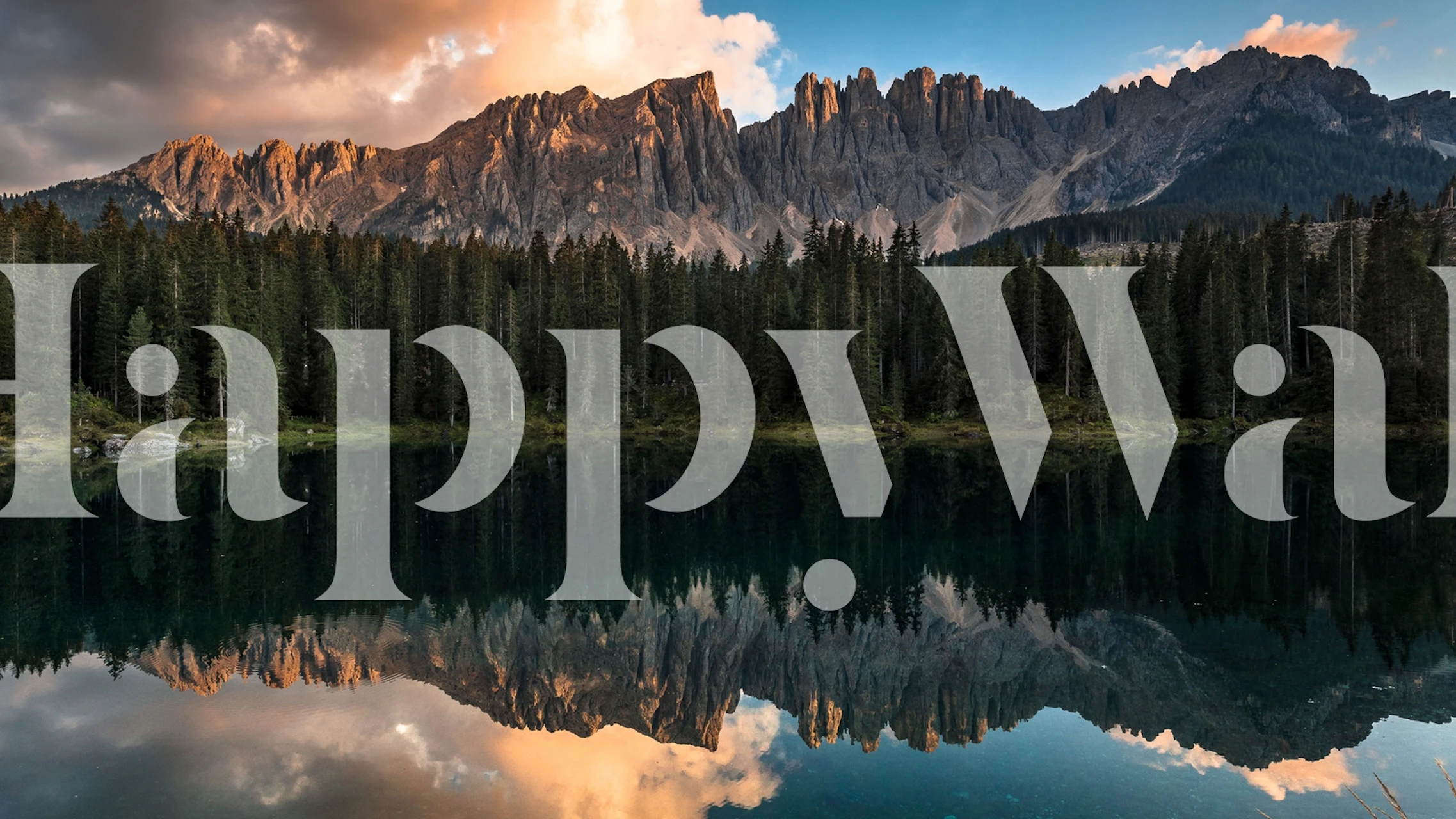 Mountain landscape with sunset and reflections on water wallpaper