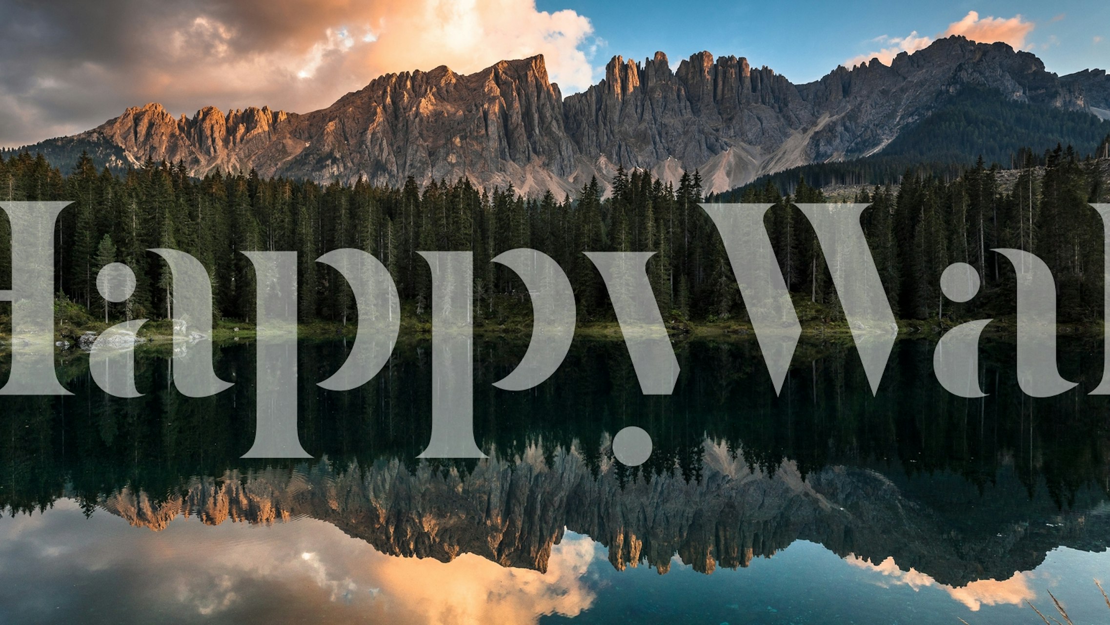 Mountain landscape with sunset and reflections on water wallpaper